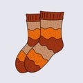 Warm knitted socks for the cold season. Vector illustration. A pair of brown wool socks for adults or children. warm and cozy stri